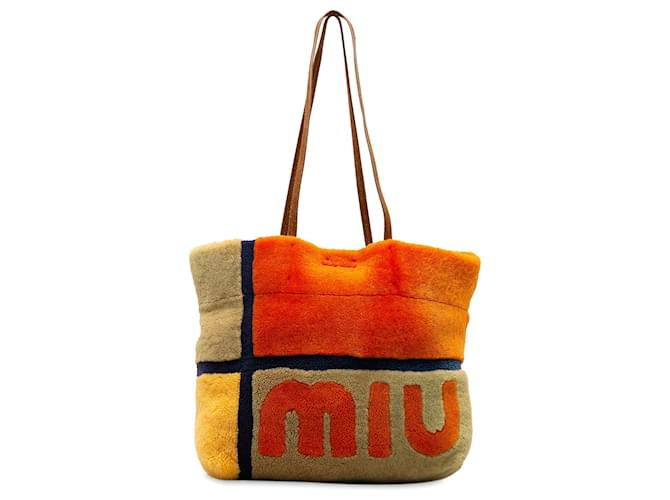 Miu Miu Cabas en peau de mouton à logo orange Fourrure  ref.1224296