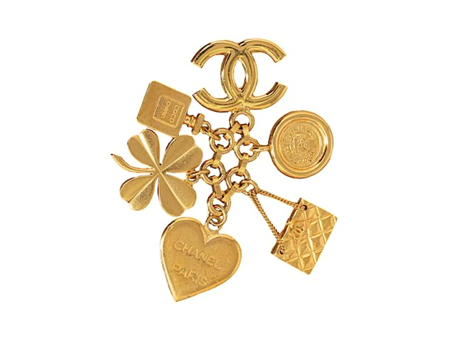 Broche con dijes de icono de Chanel dorado Metal  ref.1240313