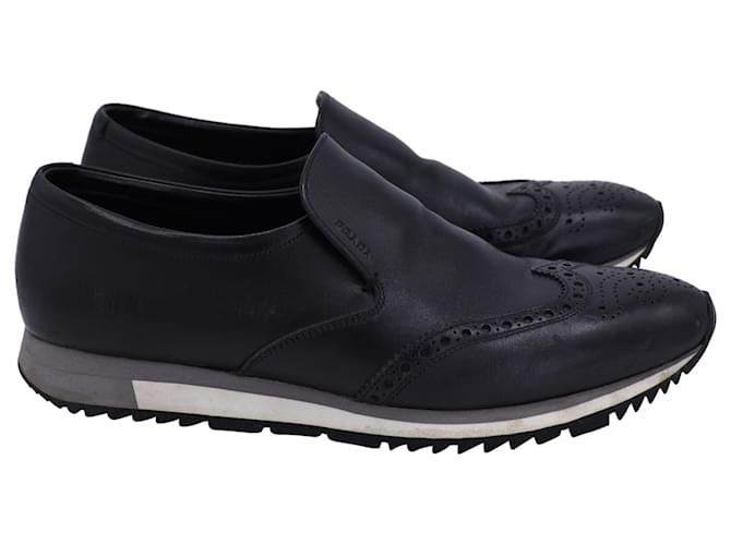 Prada Slip-On-Sneaker im Brogue-Stil aus schwarzem Kalbsleder Kalbähnliches Kalb  ref.1244042