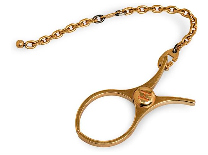 Hermès Hermes Gold Filou Handschuhhalter Golden Metall Vergoldet  ref.1251735