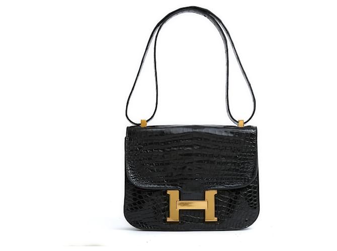 Hermès Bolsa de couro preto precioso Hermes Sac Constance.  ref.1252226