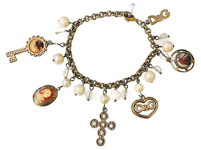 Magnifique bracelet vintage rare DOLCE & GABBANA en acier doré avec camée croix et divers charms  ref.1258188