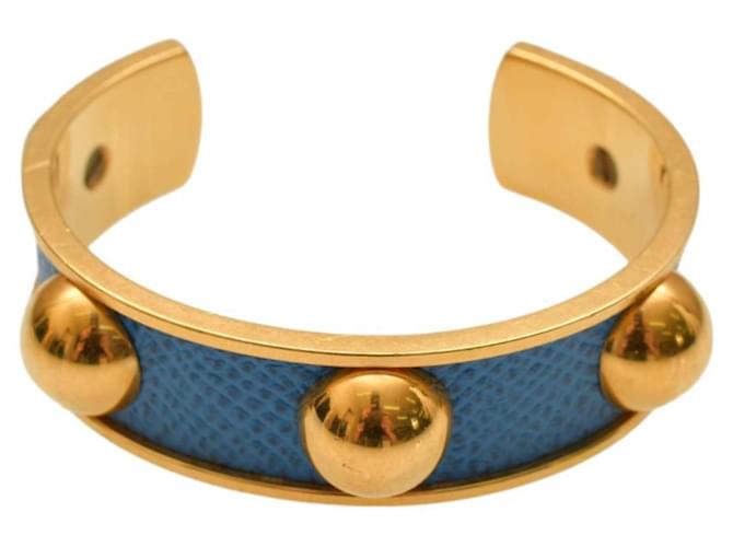 Bracciale rigido vintage Hermès in pelle blu stampata con finiture in metallo placcato oro. Placcato in oro  ref.1265952