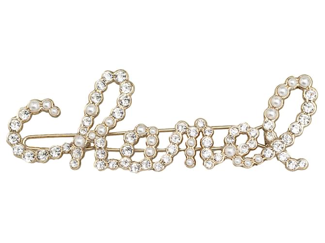 Barette à logo tourbillonnant de strass dorés et de perles Chanel Métal Plaqué or  ref.1266329