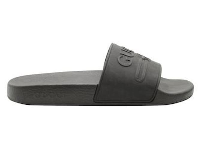 Gucci Chanclas de goma con logo en relieve en negro  ref.1286281