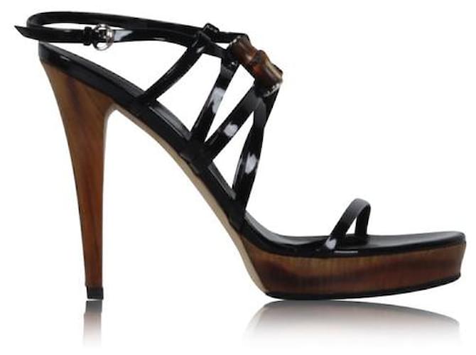GUCCI Chaussures Gucci noires avec talons en bois et détails en bois sur le devant  ref.1288486