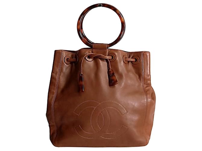 Chanel bucket style handbag with drawstring in leather and bone Brown  ref.1293447