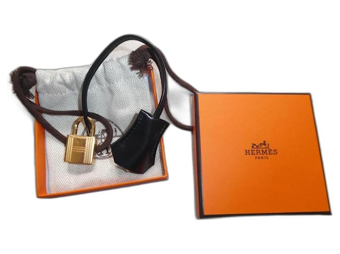 sininho, puxador e cadeado Hermès novos para bolsa Hermès, caixa e saco de pó. Preto Couro  ref.1294146