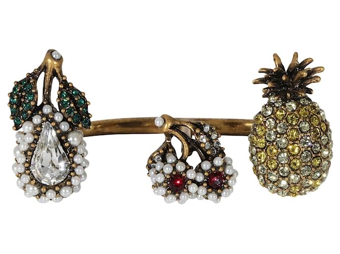 Gucci-Fruchtanhänger aus künstlichen Perlen und Kristallen zwischen dem Fingerring Metallisch  ref.1296239