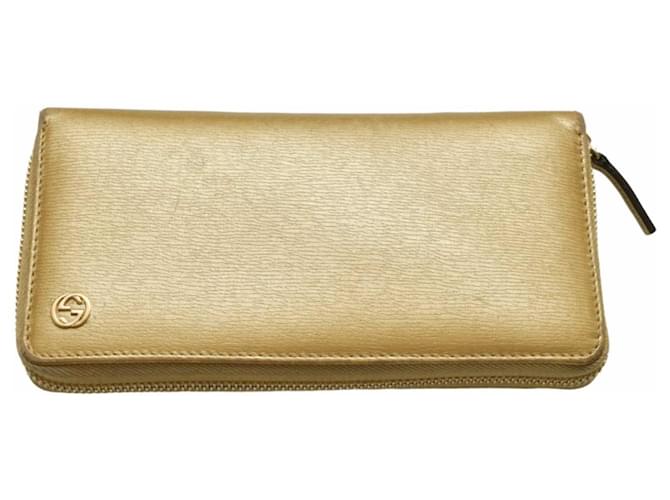 Billetera larga Gucci GG de cuero dorado con cierre alrededor y caja original.  ref.1301389
