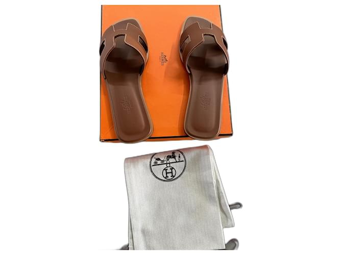Hermès sandales Hermes Oran dorées Cuir Marron  ref.1302385