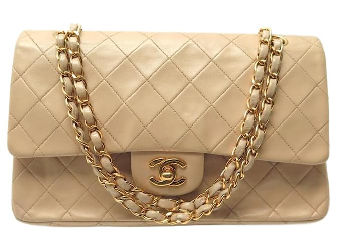 VINTAGE CHANEL TIMELESS CLASSIC MEDIUM BANDOULIERE HAND BAG Beige Leather  ref.1306783
