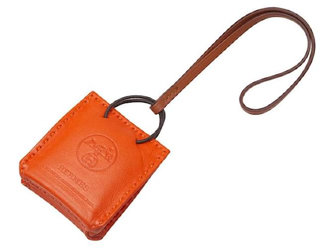Hermès Ciondolo per borsa Swift Shopper Arancione Vitello simile a un vitello  ref.1316986