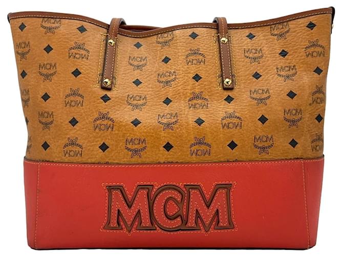 Bolsa Shopper MCM, bolsa de mão, bolsa de alça, cor conhaque vermelho, estampa de logotipo.  ref.1318586