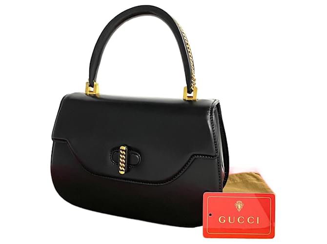 Bolso de mano de cuero Gucci con cierre de palanca en muy buen estado  ref.1318683