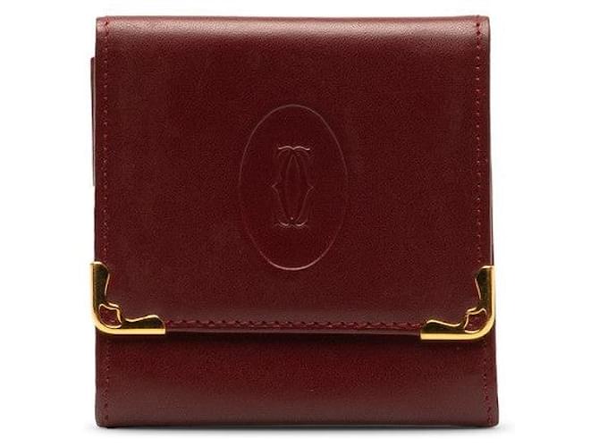 Monedero de cuero de la línea Must de Cartier en color rojo vino en muy buen estado Roja  ref.1319803