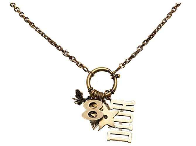 Collar Dior con dijes y logotipo dorado Metal Chapado en oro  ref.1327792