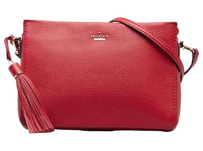 Sac à bandoulière en cuir avec logo Kate Spade et pompon rouge en très bon état  ref.1329005