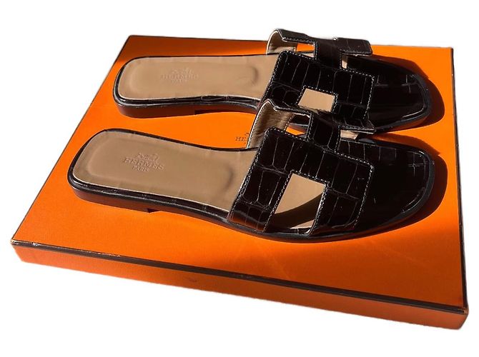 Oran Mules Hermès em couro de jacaré preto