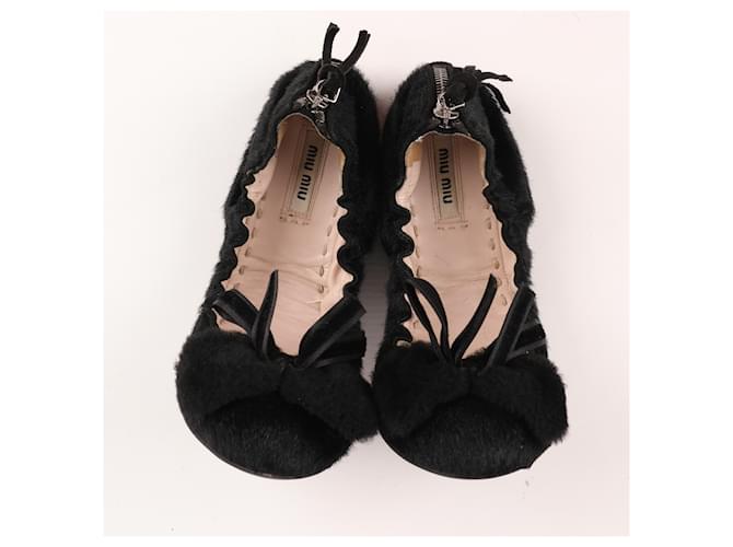 Miu Miu Schwarze Ballerinas mit Ponyhaarschleife 5F8190 F005 Kalbähnliches Kalb  ref.1393506