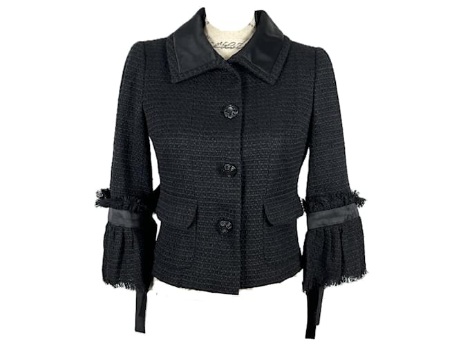 Chanel Nueva chaqueta de tweed negro con botones de camelia CC.  ref.1394246