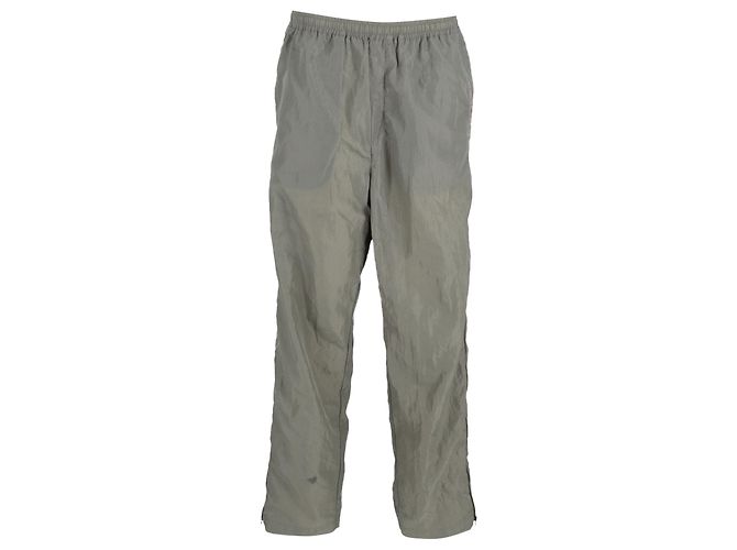 Pantalones de chándal de nailon verde con detalle de cremallera y ribetes de terciopelo de Acne Studios Caqui