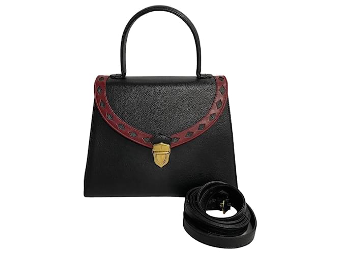 Sac à main en cuir Yves Saint Laurent à découpe en diamant Sac à main en cuir en très bon état  ref.1411951