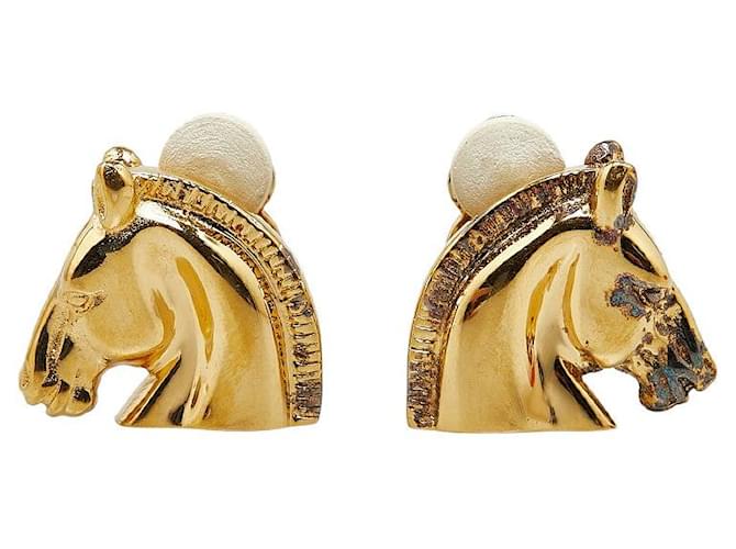 Hermès Boucles d'oreilles grandes têtes de cheval Hermes en plaqué or en très bon état Métal Doré  ref.1419524