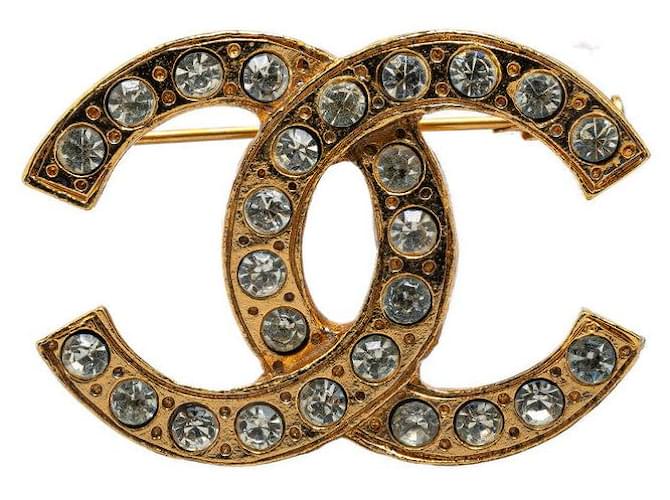 Broche Chanel Vintage Coco Mark Strass Plaqué Or en Très Bon État Métal Doré  ref.1422471