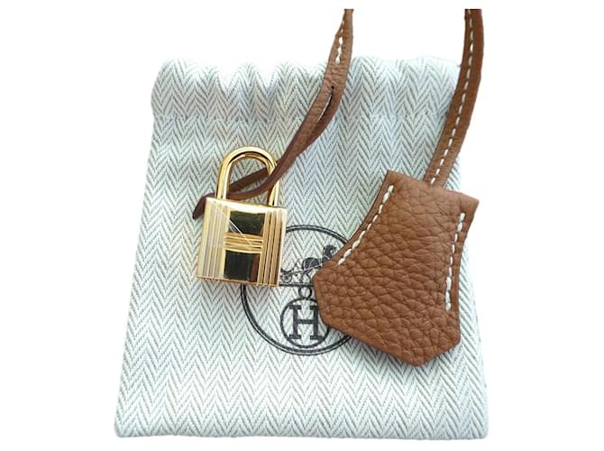 bell, pull tab and new hermès togo leather gold kelly birkin lock Camel  ref.1422748