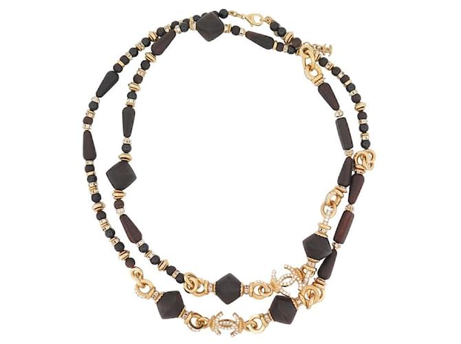 NINE CHANEL NECKLACE SAUTOIR CC LOGO & WOODEN BEADS 110-115 GOLD METAL NECKLACE Golden  ref.1429041