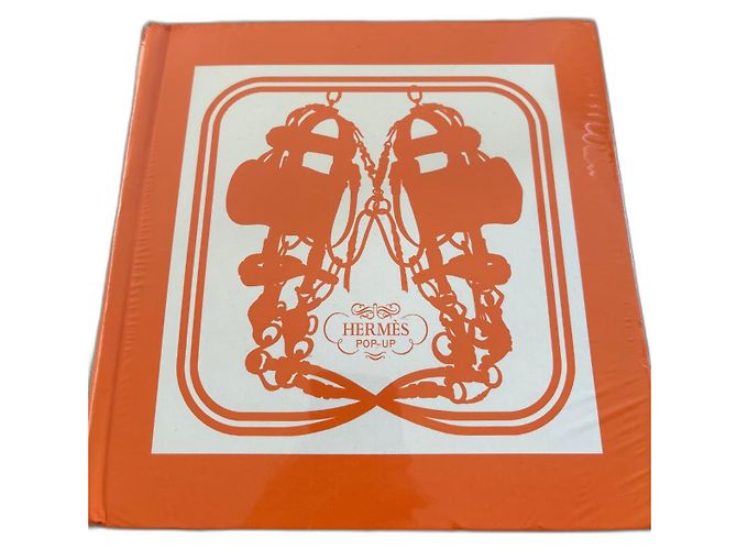 Hermès pop-up book under film Orange 