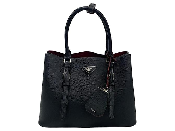 Sac à main en cuir Saffiano Cuir à double poignée Prada en très bon état Noir  ref.1432592