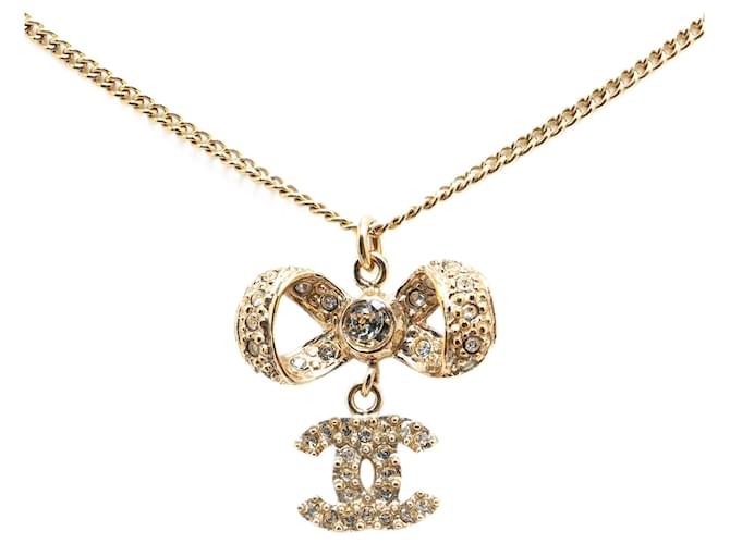 Chanel Gold Gold Plated CC Crystal Ribbon Bow Pendant Necklace Golden Metal Gold-plated  ref.1439746