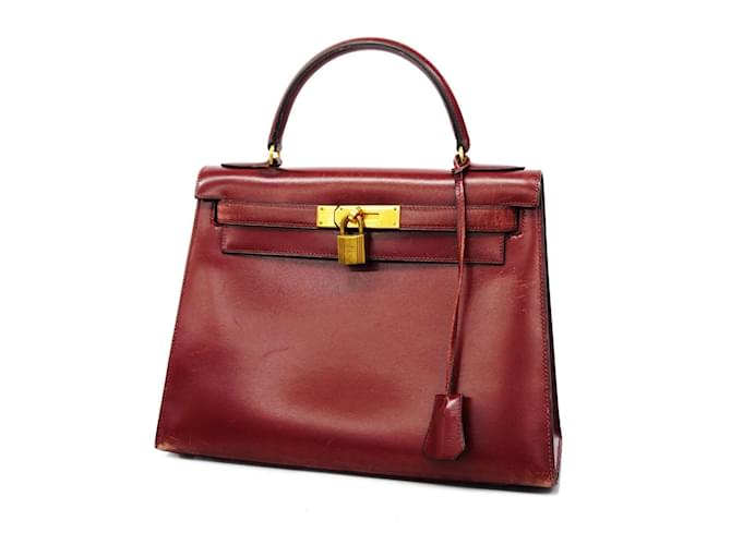 Hermès Hermes Kelly Handbag in Bordeaux Box Calf Leather Dark red Pony-style calfskin  ref.1446809