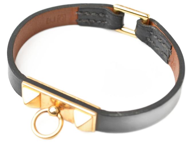 Hermès Bracciale rigido nero e oro Hermes Micro Rival 