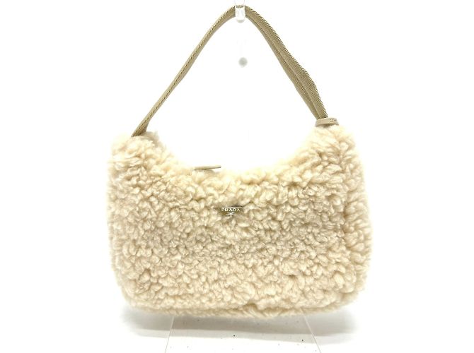 Borsa in pelliccia beige Prada 1NE515