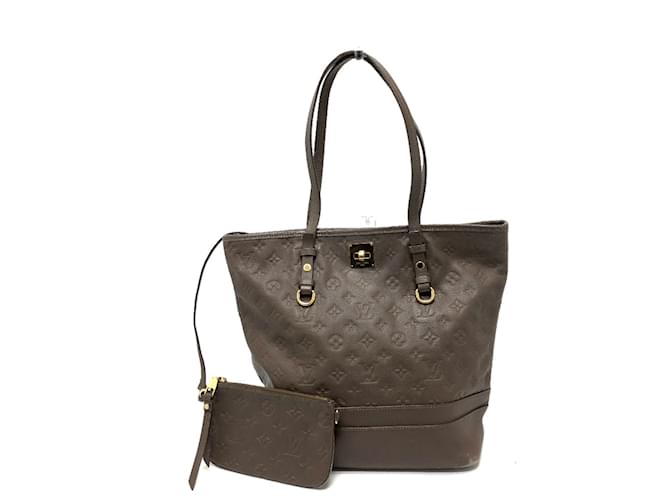 Bolsa tote Monogram Empreinte Louis Vuitton Marrom  ref.1455849