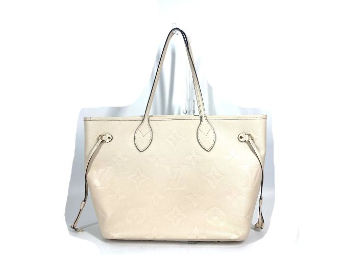 Sac tote Monogram Empreinte Louis Vuitton Beige
