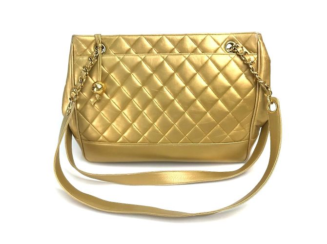 Bolsa Chanel Coco Ball de couro dourado