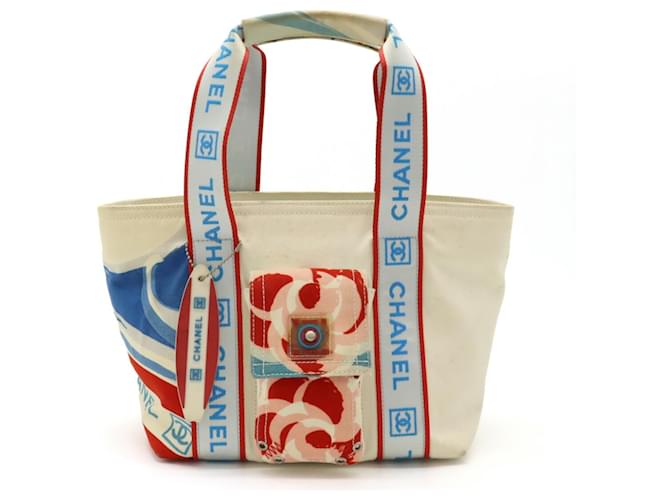 Sac tote Camellia de la ligne Sport de Chanel pour l'été haut de gamme Toile Rouge Écru Bleu clair  ref.1486703