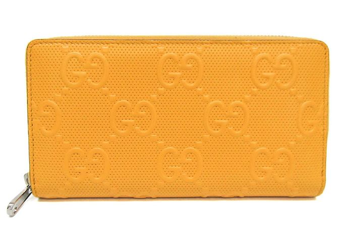 Cartera larga de cuero amarillo con estampado GG de Gucci