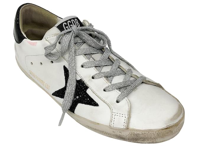 Baskets en cuir Superstar GGDB blanches argentees noires a paillettes de la marque Golden Goose Deluxe Brand ref.1586445 Joli Closet