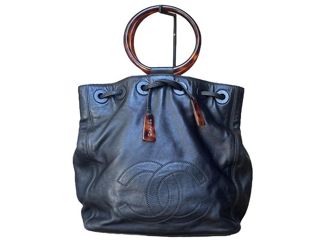 Vintage CHANEL Drawstring Tortoise Ring Top Handle Bag Black
