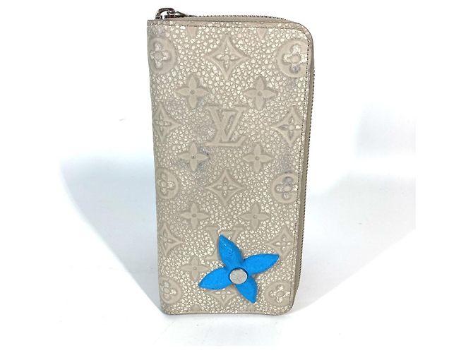 Zippy Geldbörse aus Taurillon Climbing von Louis Vuitton Blau Beige