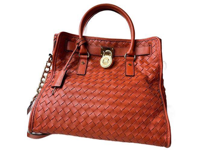 Bolsa Michael Kors Hamilton em couro trançado laranja