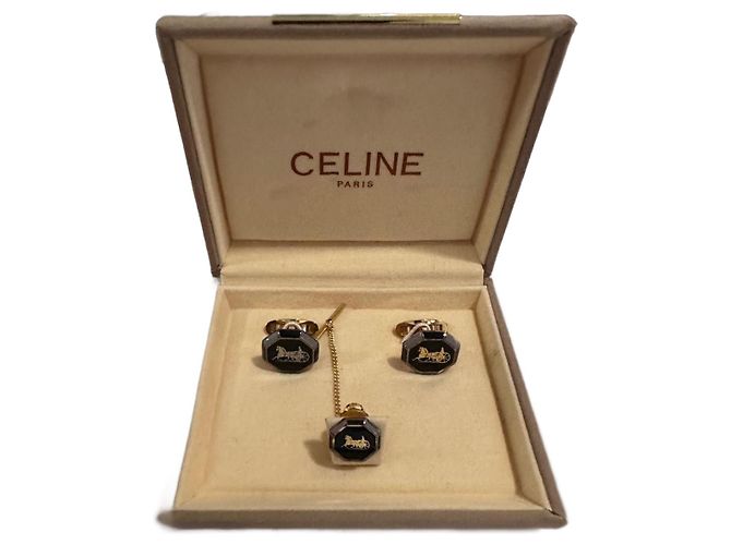 Céline Gemelos y pin de corbata Celine
