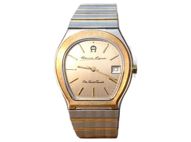 Montre à quartz Etienne Aigner réf 463 221 Argenté Doré