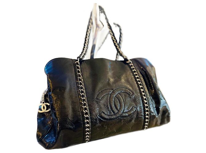 Trendy CC Bolso Chanel de charol negro
