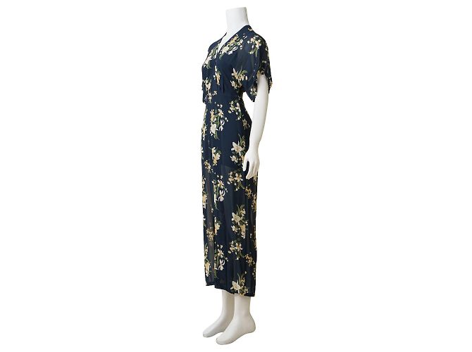 Reformation Macacão com decote profundo e estampa floral